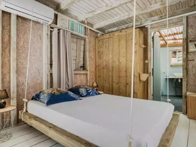 A louer Case Pilote Maisonnette en bois de type Studio