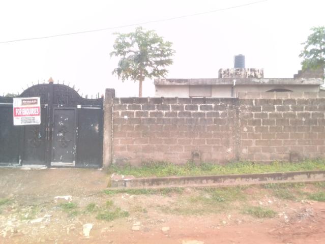 A plot of land with 2 number 2bedroom flat fenced with gate