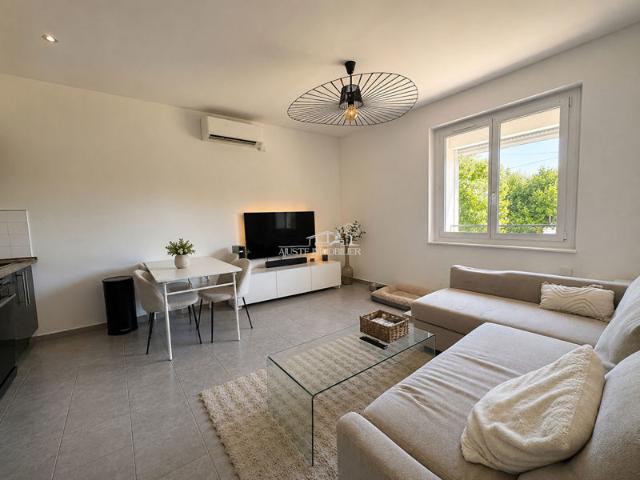 A VENDRE ? Charmant appartement T3 de 51 m² avec cour privative de 38 m², garage et abri voiture