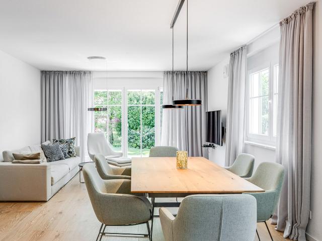 AIGNER Moderne 2,5 Zimmer Wohnung mit Hobbyraum und Terrasse in ruhiger Lage