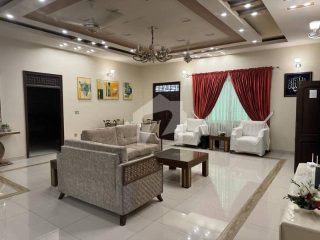 Almost brand new 400 sq yards double story 100 feet road house available for sale