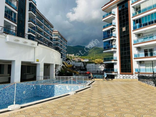 Alanya Cikcilli’de Deniz Ve Dağ Manzaralı Prestijli Sitede 1+1 Satılık Daire