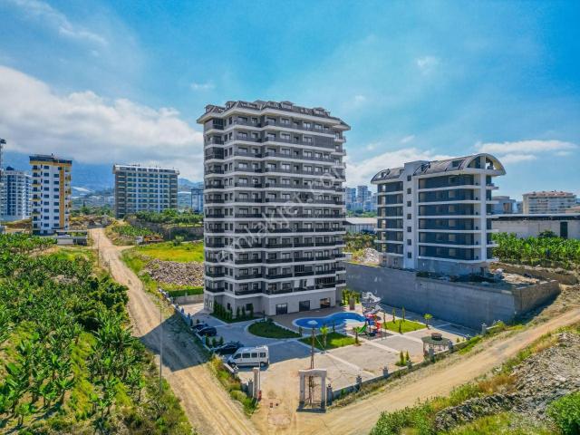 Alanya Mahmutlar'da Sıfır Binada Full Aktiviteli 1+1 Satılık Daire