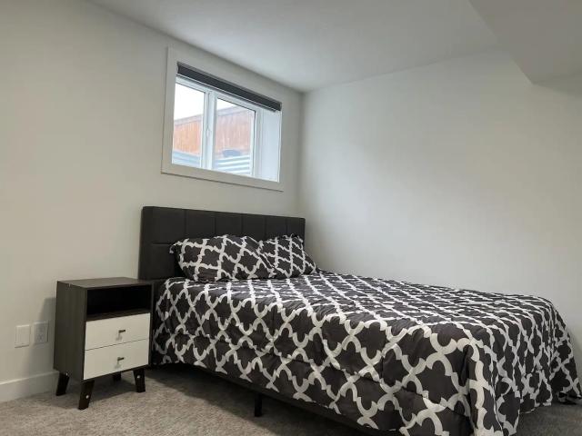 ALL INCLUSIVE FULLY FURNISHED ONE 1 BEDROOM SUITE WITH GARAGE PARKING