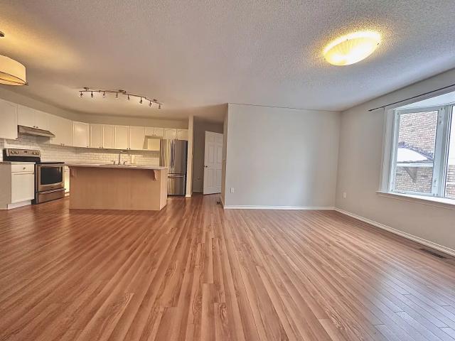 ALL INCLUSIVE TWO BEDROOM UPPER LEVEL APARTMENT IN KINGSTON'S WEST END WITH GARAGE