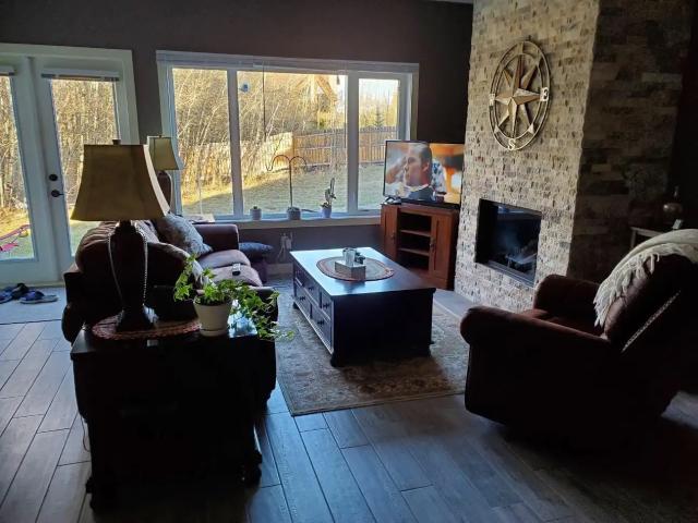 All inclusive 2 bedroom lower level on an acreage surrounded by trees