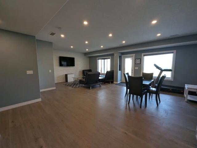 All utilities included and furnished walk out basement on green belt