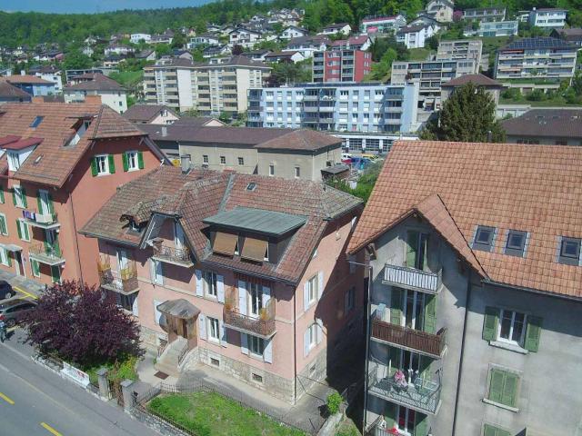 Als Finanzinvestition gehaltene Immobilie im Herzen von Peseux