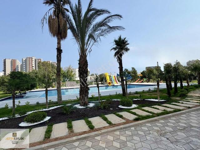 Altın Emlak'tn Yola Yakın Geniş Peyzajlı,aquaparklı Sitede 2+1