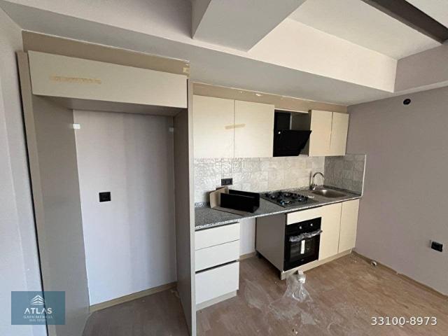 ALTINTAŞ'DA ERMENEK ORTAOKULUNA YAKIN SİTEDE SIFIR ARA KAT 2+1