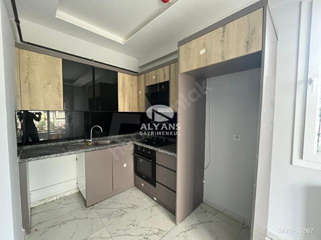 ALYANS'TAN SİTE İÇERİSİNDE OTOPARKLI JENERATÖRLÜ 1+1