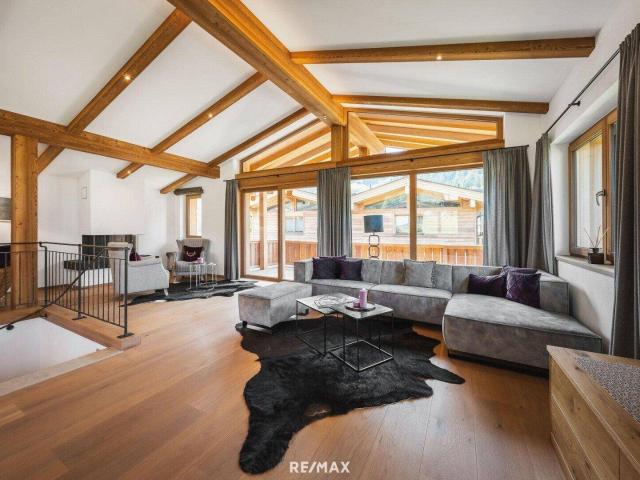„Ankommen. Durchatmen. Bleiben. – Ihr Chalet in Aurach“