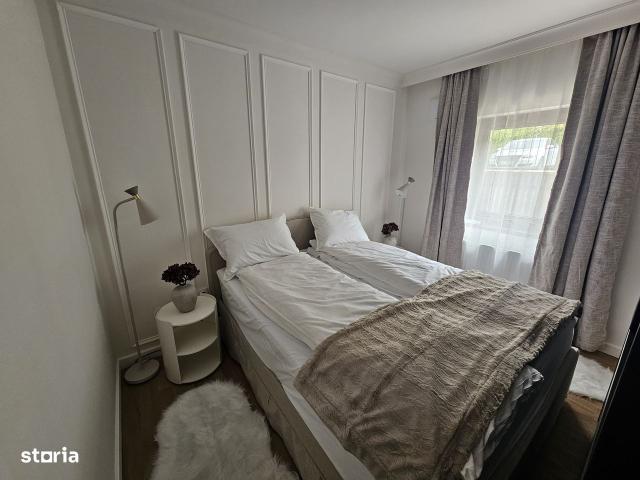 Apartament modern cu grădină superbă și parcare acoperită