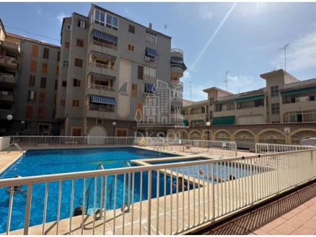 Apartamento en planta baja con piscina comunitaria en playa de la Acequión