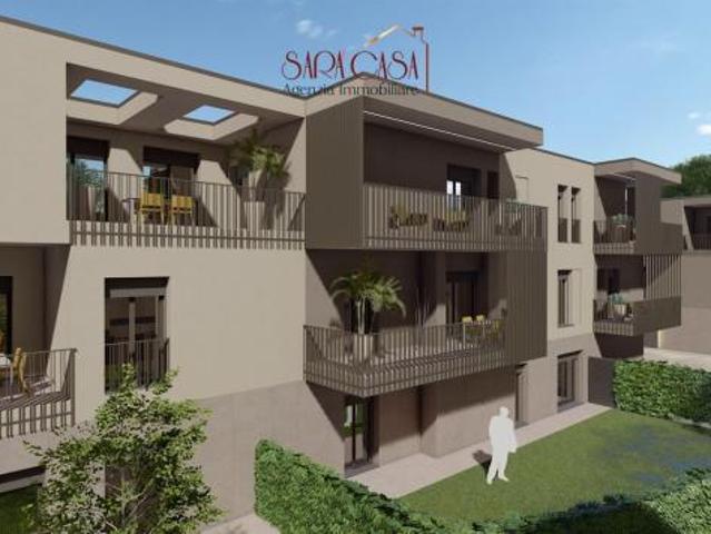 Appartamento con ampio giardino, garage e posto auto