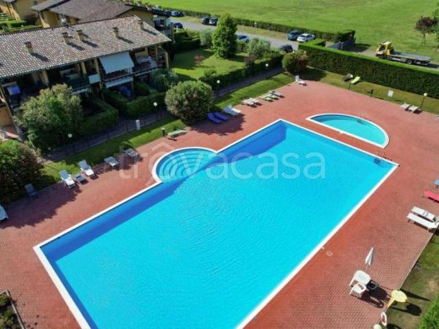 Appartamento in affitto a Desenzano del Garda via Giunio Bruto, 16, arredato, giardino privato, posto auto TrovaCasa