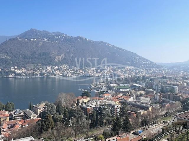 APPARTAMENTO NUOVO IN VILLA CON AMPI TERRAZZI E MAGNIFICA VISTA LAGO E CITTA'