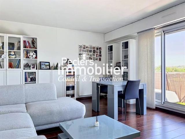Appartement 2P/1CH loué meublé 52,46m2 Balcon et place de pa
