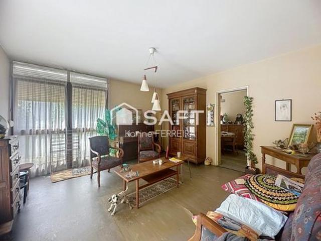 Appartement 3 pièces de 58 m² à rénover avec balcon, cave et stationnement