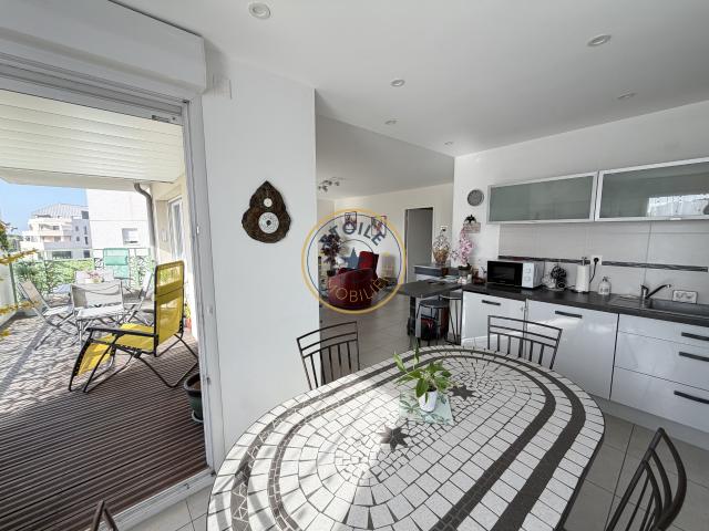 Appartement T3 avec terrasse couverte et double garage dans une résidence récente et sécurisée