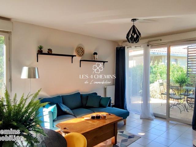 Appartement à louer 3 pièces de 63 m2 avec terrasse et 2 parkings en sous sol