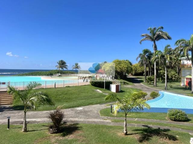 APPARTEMENT ANSE DES ROCHERS JOLIE VUE MER ET PISCINE