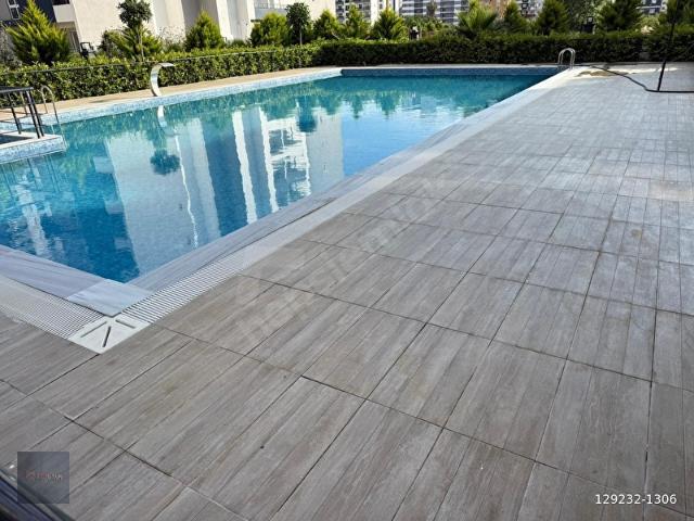 ARPAÇBAHŞİŞ'TE SIFIR 2+1 HAVUZLU SATILIK DAİRE.