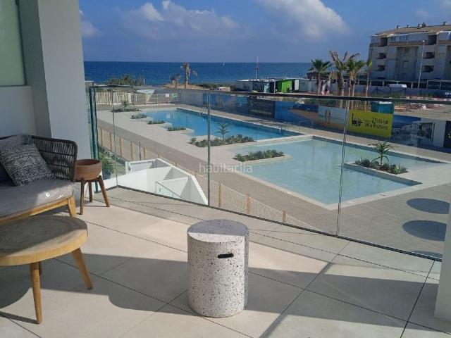 Ático en venta en Dénia, L'Almadrava L'Estanyó. Ático de 3 dormitorios y 2 baños con piscina y jardín, en primera línea de playa en Denia. Áticos.