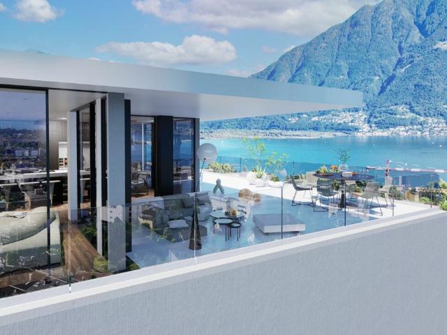 Attico da sogno con vista lago, wellness e piscina