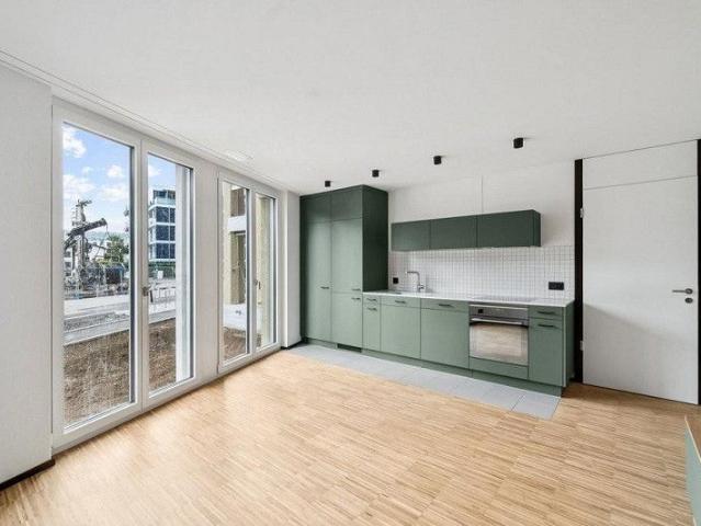 Attraktive und charmante Neubauwohnung mit Sitzplatz an bester Lage