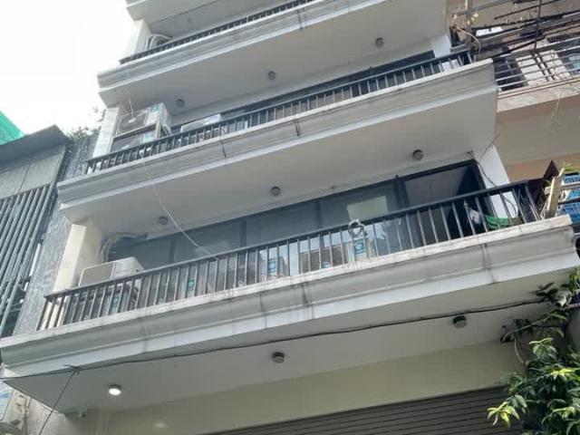 Bán nhà mới, đẹp phố Hoàng Cầu, Đặng Tiến Đông, 55m2, 8 tầng, mt 6.9m, gara ô tô, thang máy, giá
