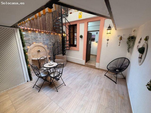 Bajo con terraza en finca modernista con ascensor