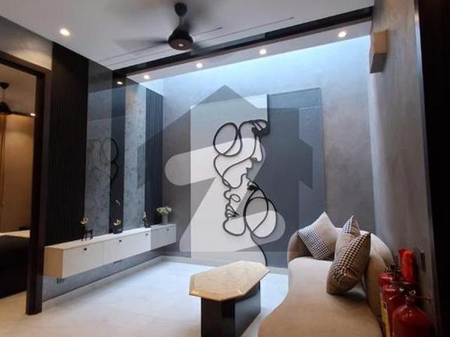 Beautifull independent 5 marla designer house near to market and easy accsess to main road in dha lahore dha 9 town