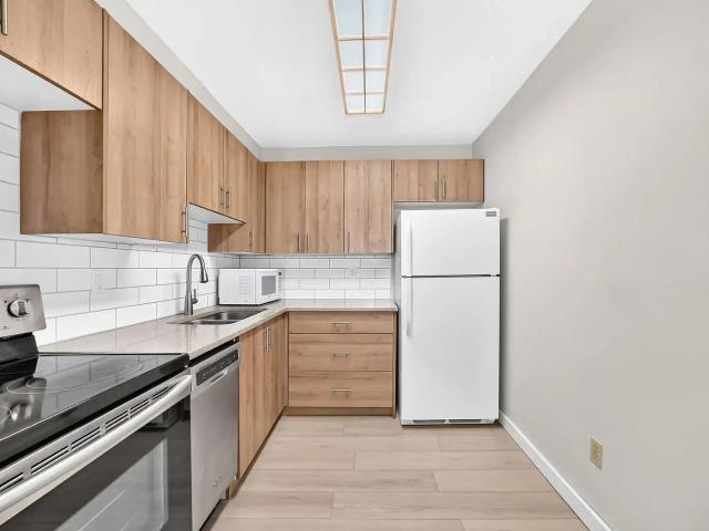 Beautifully Renovated 2 Bedroom Condo | Walk to LRT & Southcentre Mall |