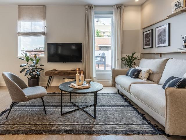 Beach Inspired 3 Bedroom Apartment with Terrace and Workspaces in Malasaña, Madrid Amsterdam Apartments for Rent
