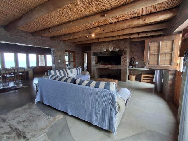 Beachfront Elegance: Expansive Mansion with 7 En Suite Bedrooms & Endless Views