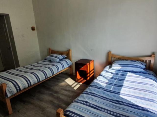 Bed in a homely twin bedroom, in Broadstone