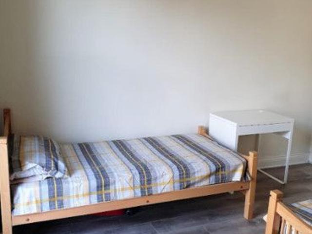 Bed in a homely twin bedroom, in Broadstone