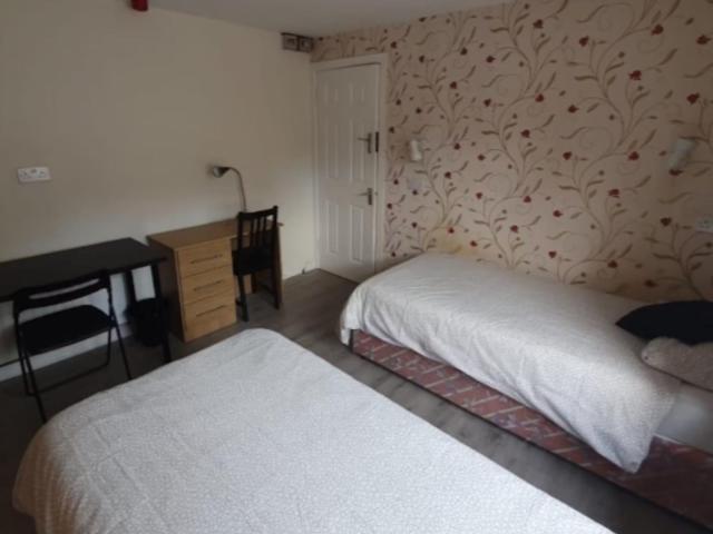 Bed in a homely twin bedroom, in Drumcondra