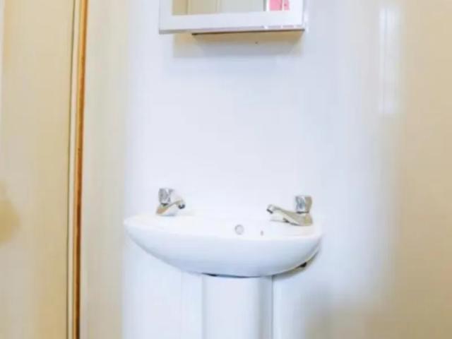 Bed in a homely twin ensuite bedroom, in Phibsborough