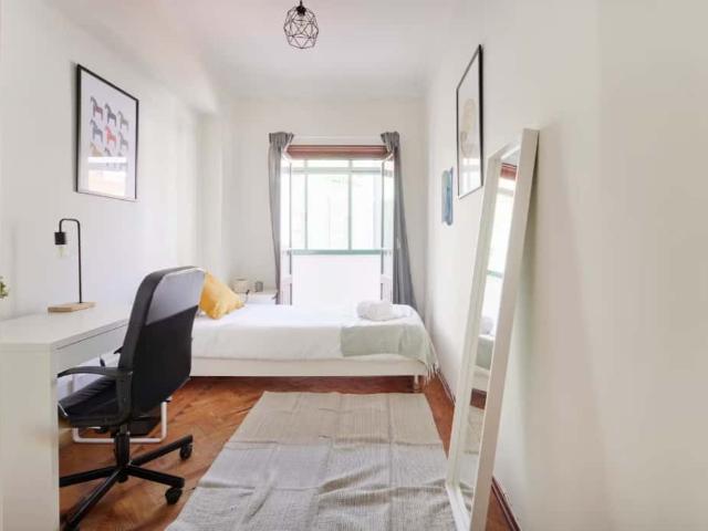 Bedroom in a 8 bedroom apartment in R. Diogo Couto, Lisbon Room 2