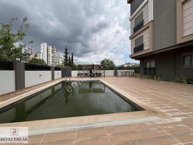Beyaz'dan Demirel'de Eşyalı Havuzlu Asansörlü Katta 1+1 Kiralık