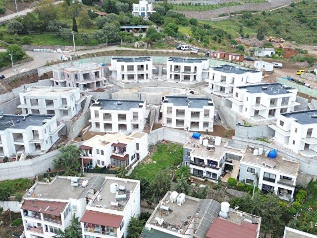 BODRUM TURGUTREİSTE MUHTEŞEM MANZARALI HAVUZLU SİTEDE PROJEDEN SATILIK DAİRELER