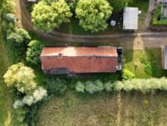 Bouwgrond met te slopen woning in hartje Hansbeke