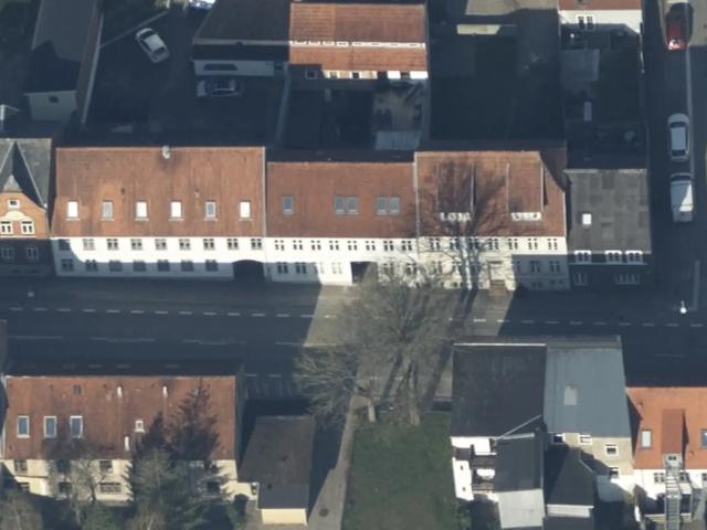 Blandet ejendom med bolig og erhverv i centralt Haderslev
