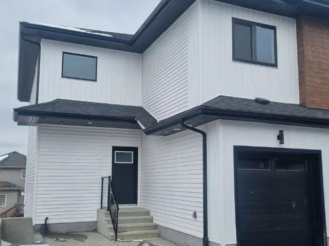 Brand New 3 Bedroom Townhome in Hawks Ridge Area Ready Immediately
