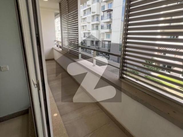Brand new 1203 sqft a building one bed room with maid room apartment available for rent with balcony penta square by dha lahore