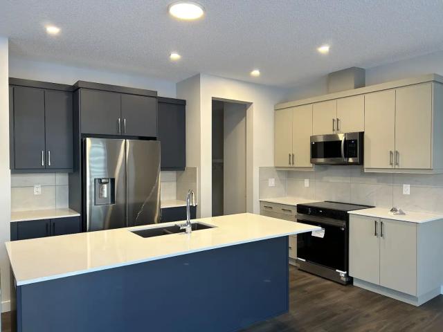 Brand New 4 Bedroom + Den Main Floor Home