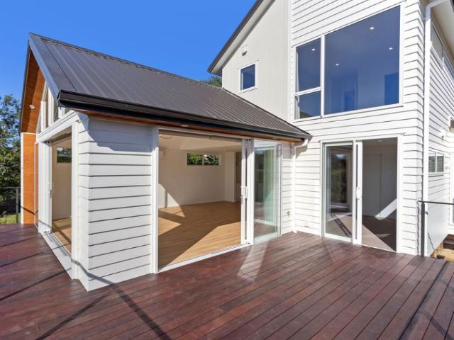 BRAND NEW Five Bedroom home overlooking Waiatarua reserve