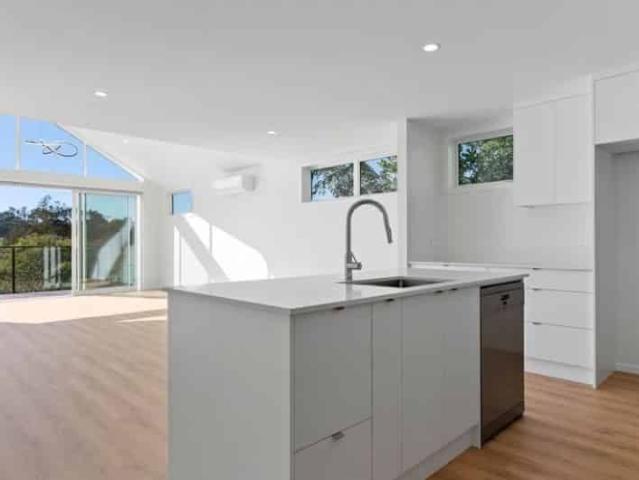 BRAND NEW Five Bedroom home overlooking Waiatarua reserve